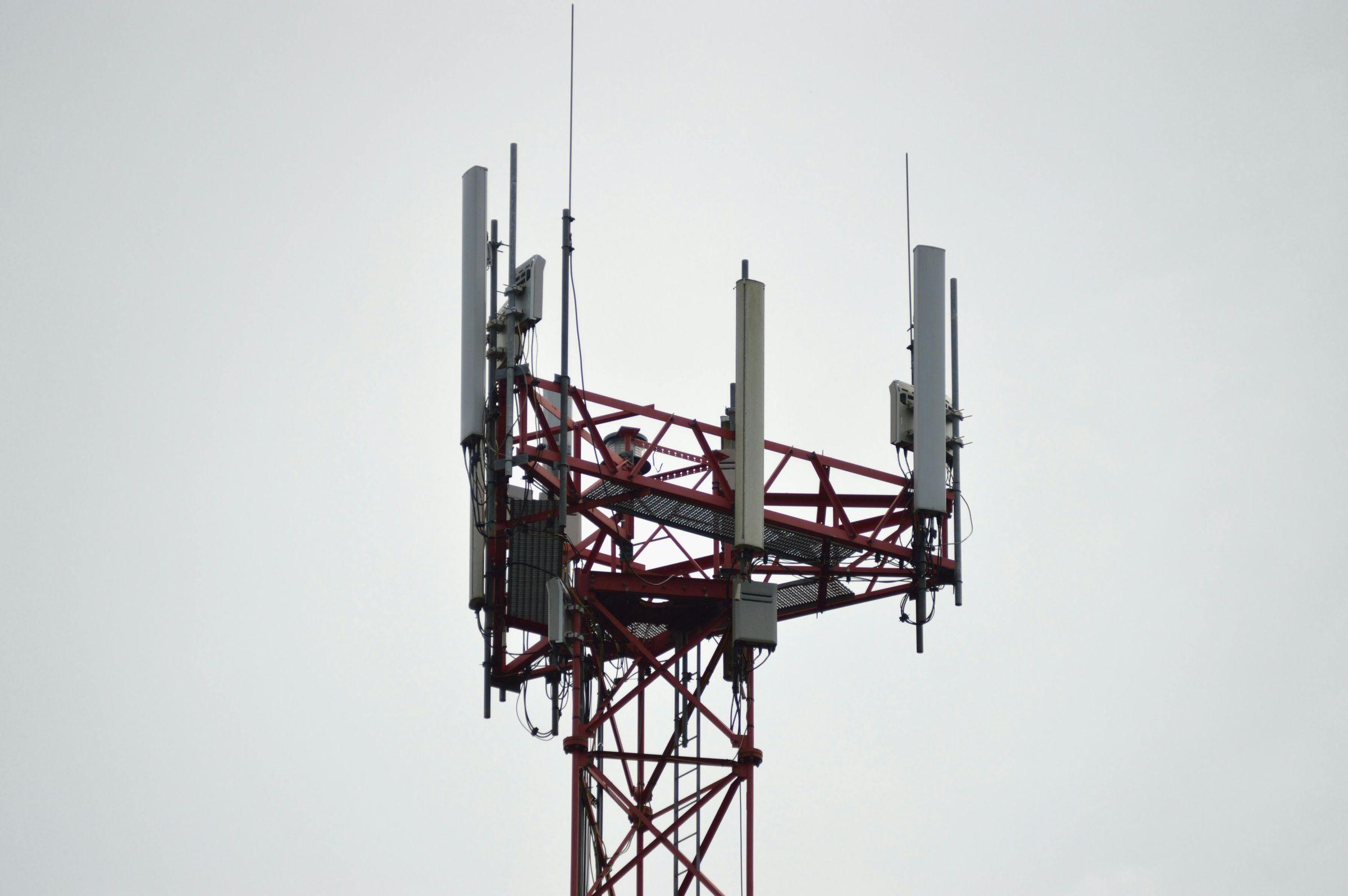 Cell tower top with sector antennas and radio units
