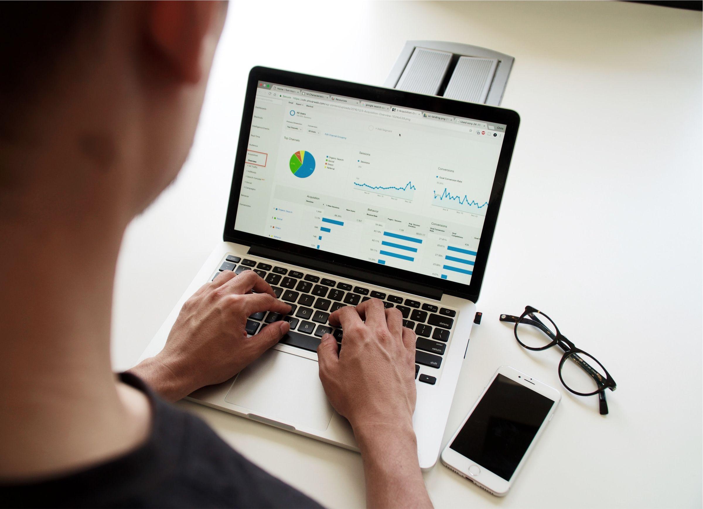 Engineer reviewing analytics dashboards on a laptop